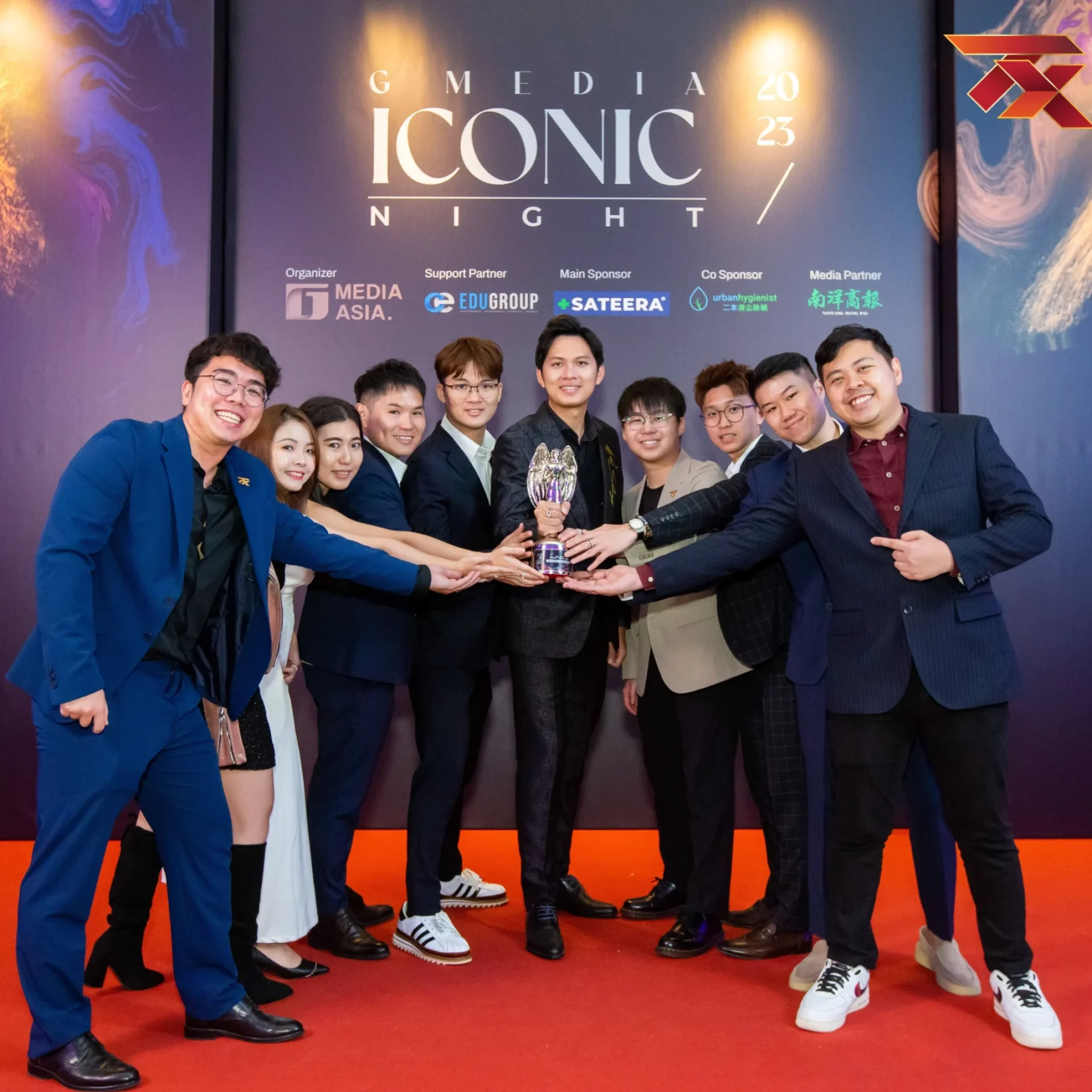 TX Academy team holding a trophy at the Media Iconic Night awards