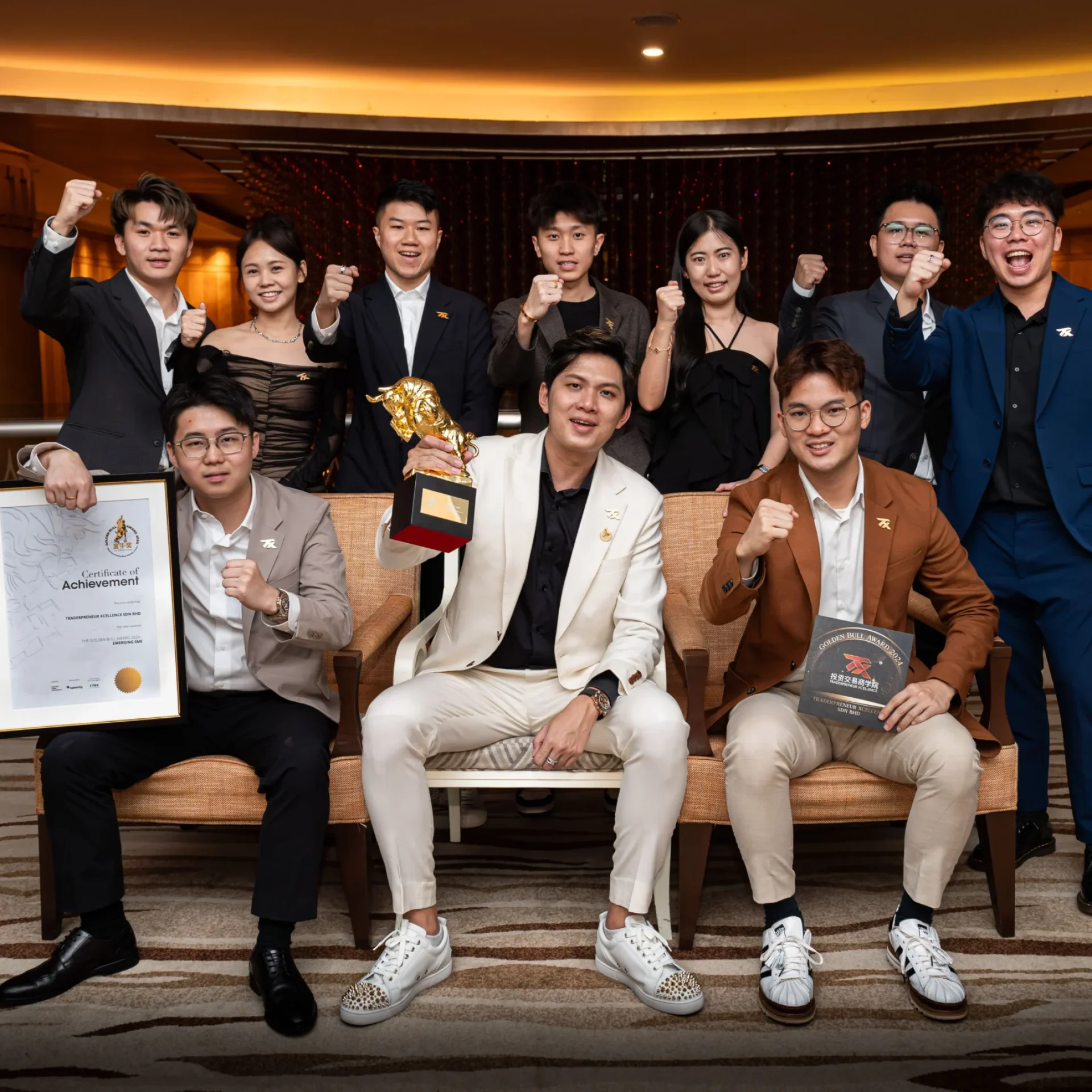 TX coaches and students posing with an award certificate at an awards dinner